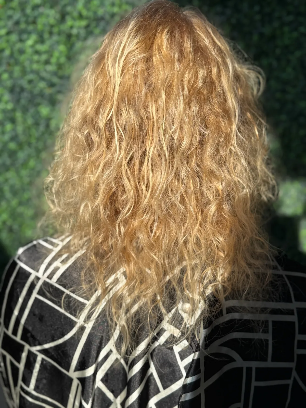 Before: curly blonde hair above the shoulder blades.