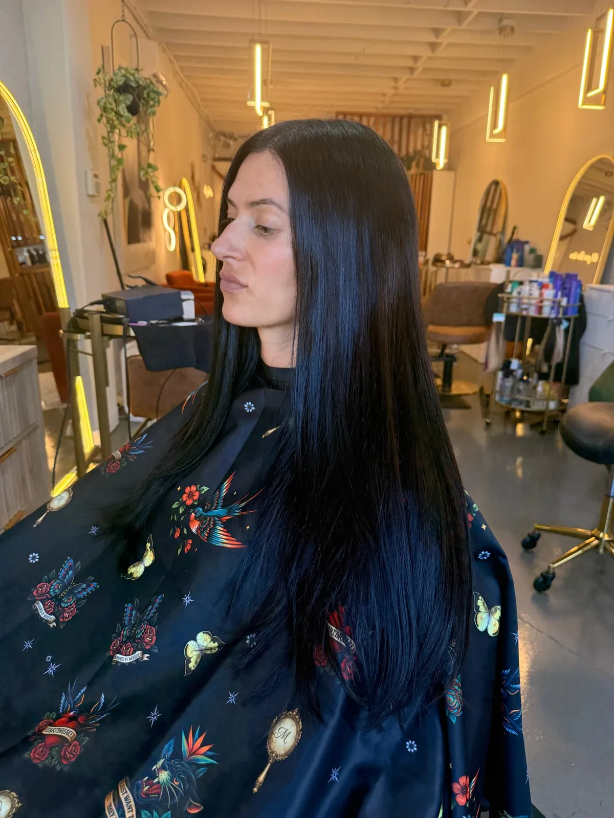 After: sleek, fuller black hair from the side.
