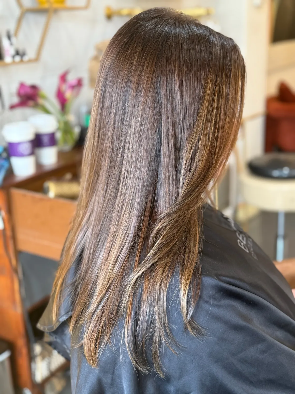 Before: straight brunette hair with caramel highlights, past the shoulders.