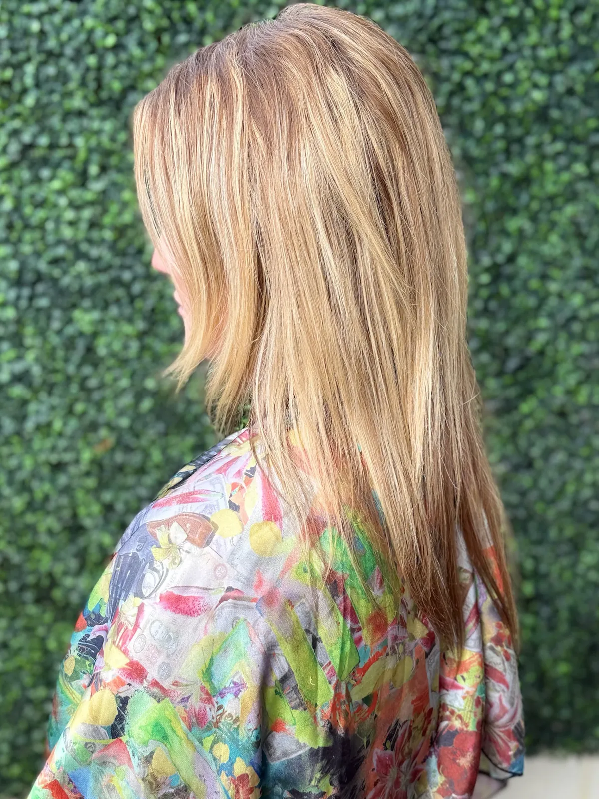 Before: layered blonde hair from the side.