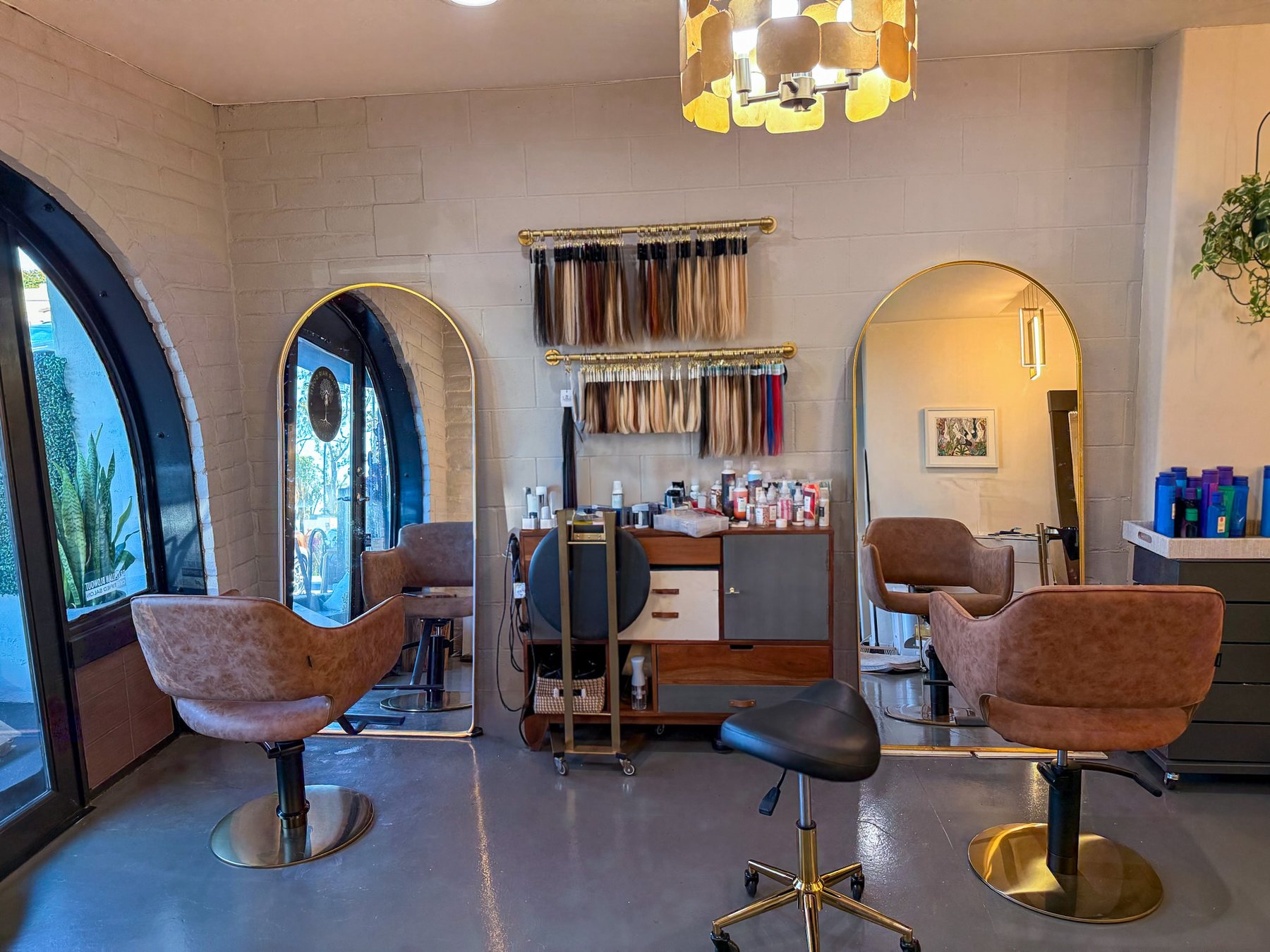 The salon interior on Adams Avenue, arch doorway and lit arch mirrors.
